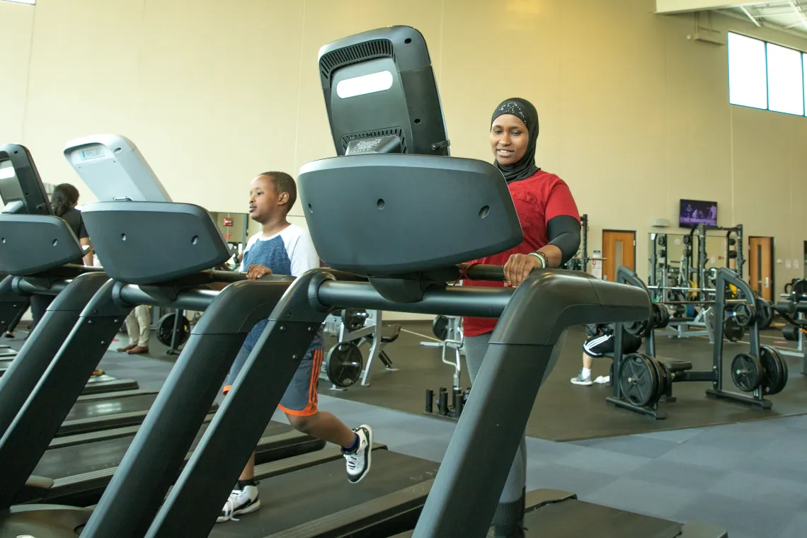 Woman and child on treadmill